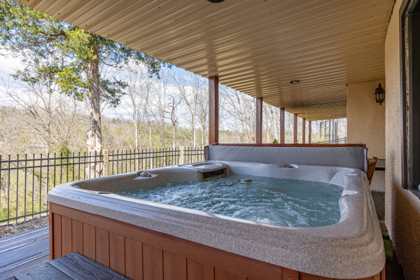 Hot Tub on Covered Deck at Hoop Dreams Lodge
