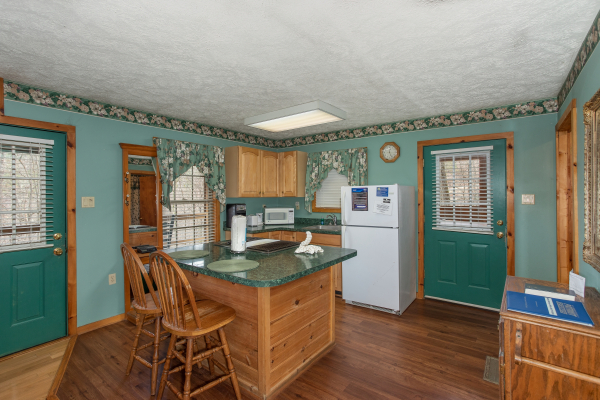 Kitchen with island at Hideaway, a 1 bedroom cabin rental located in Pigeon Forge