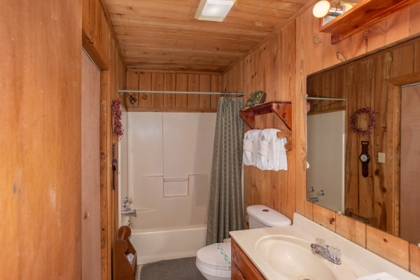 Bathroom with a tub and shower at Apple View, a 2 bedroom cabin rental located in Pigeon Forge