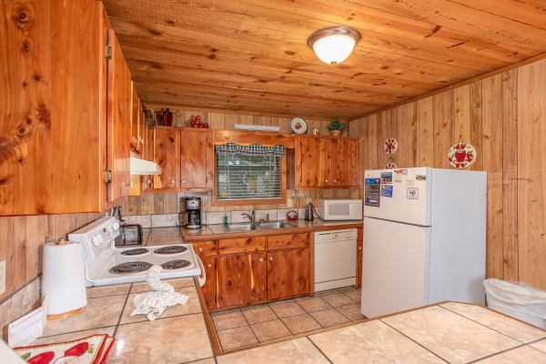 Kitchen with white appliances at Apple View, a 2 bedroom cabin rental located in Pigeon Forge