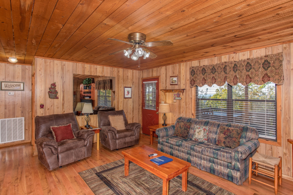 Living room with two recliners and a couch at Apple View, a 2 bedroom cabin rental located in Pigeon Forge