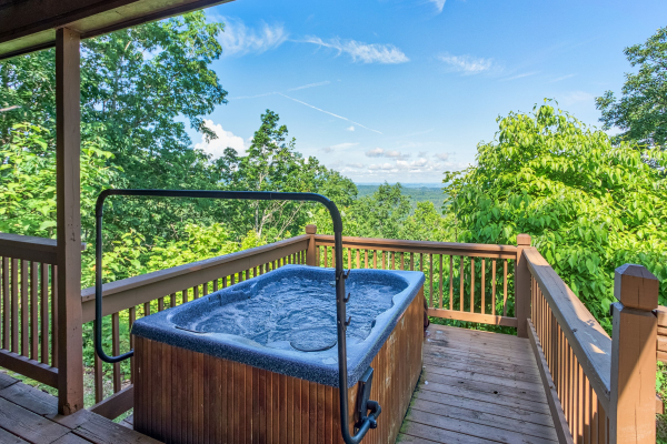 outdoor hot tub with a view at america's view a 2 bedroom cabin rental located in pigeon forge