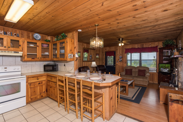 bar top dining for six in the kitchen at america's view a 2 bedroom cabin rental located in pigeon forge