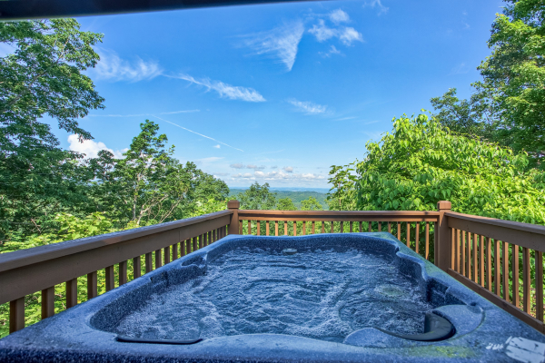 hot tub with a mountain view at america's view a 2 bedroom cabin rental located in pigeon forge