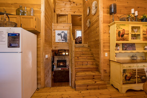 Fireplace and stairs at Sunny Side Up, a 2 bedroom cabin rental located in Gatlinburg