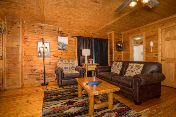 Living room seating at Moonlight in the Boondocks, a 2 bedroom cabin rental located in Gatlinburg
