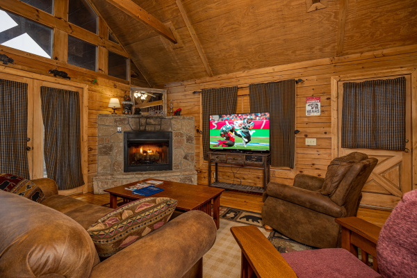 Flat screen tv and fireplace at Lincoln Logs, a 2 bedroom cabin rental located in Gatlinburg 