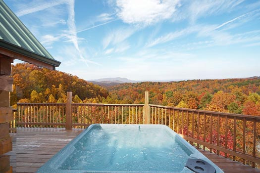 Hot tub on the main floor deck at Big Bear Lodge, a 7-bedroom cabin rental located in Gatlinburg