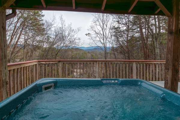 Hot tub and winter view at Beary Good Time, a 1-bedroom cabin rental located in Pigeon Forge