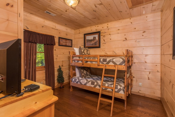Twin bunk bed on the lower floor at Patriot Pointe, a 5 bedroom cabin rental located in Pigeon Forge
