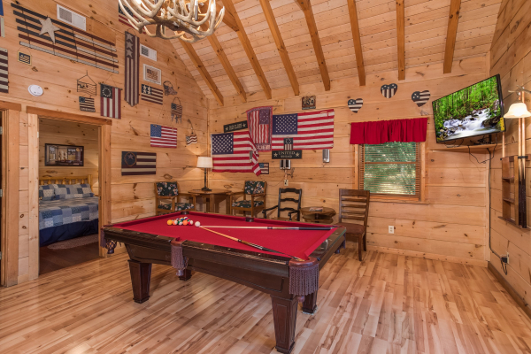 Pool table in the game room at Patriot Pointe, a 5 bedroom cabin rental located in Pigeon Forge