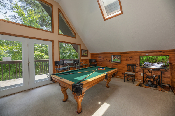 Pool table in the game loft at Amazing Memories, a 3 bedroom cabin rental located in Pigeon Forge