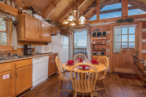 Kitchen and dining room with seating for four Bare Hugs, a 1-bedroom cabin rental located in Pigeon Forge