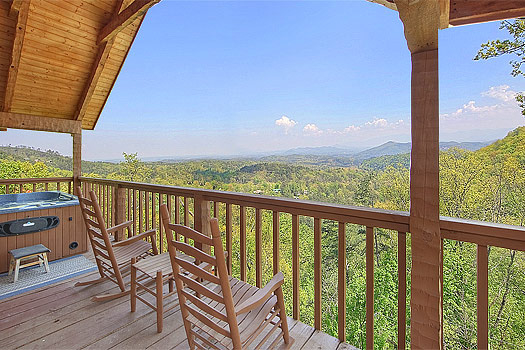 Rocking chairs on the deck at Bare Hugs, a 1-bedroom cabin rental located in Pigeon Forge