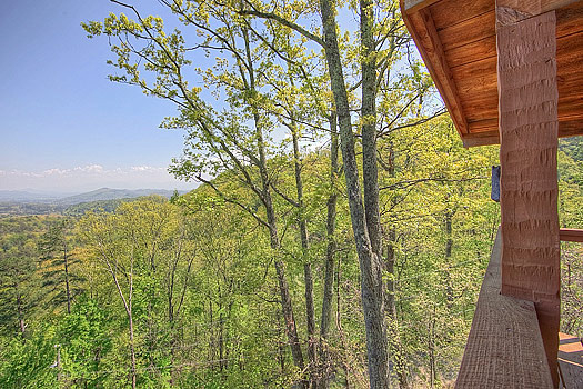View of the Smoky Mountain horizon from deck at Bare Hugs, a 1-bedroom cabin rental located in Pigeon Forge