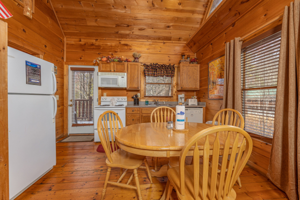 Dining table for 4 at Fallin' in Love, a 1 bedroom cabin rental located in Gatlinburg