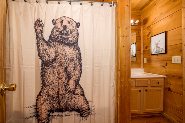 Bear shower curtain at Deerly Beloved, a 1 bedroom cabin rental located in Pigeon Forge