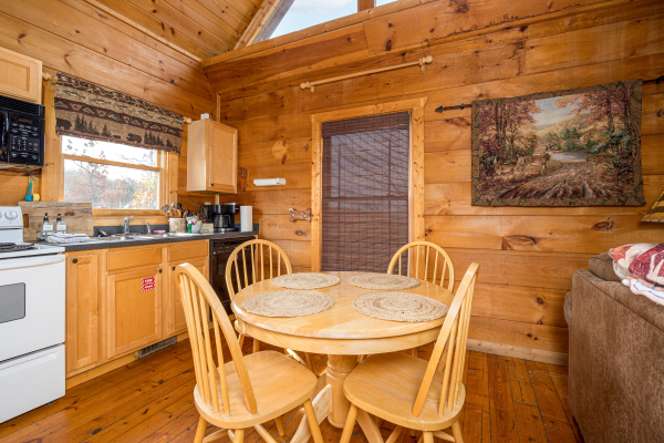 Dining table at Deerly Beloved, a 1 bedroom cabin rental located in Pigeon Forge