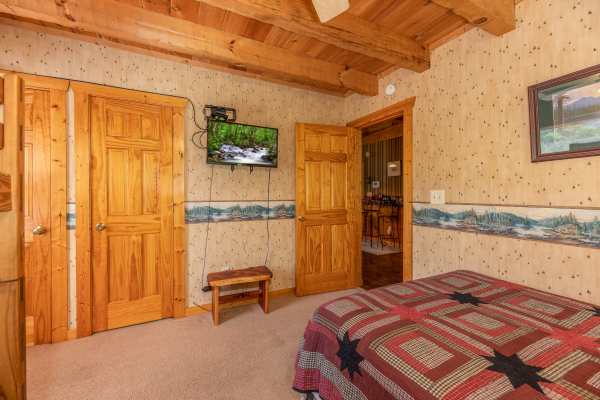 Wall mounted TV in the bunk room at Eagle's Loft, a 2 bedroom cabin rental located in Pigeon Forge