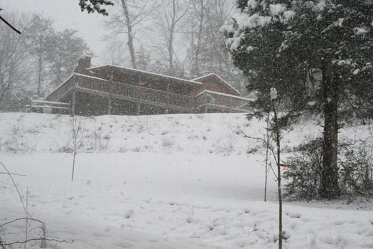 Snow covers Eagle's Loft, a 2-bedroom cabin rental located in Pigeon Forge