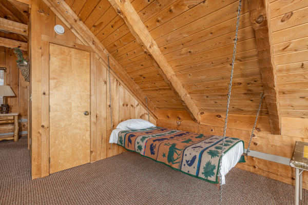 Twin bed hanging from the loft ceiling at Stellar View, a 1 bedroom cabin rental located in Pigeon Forge