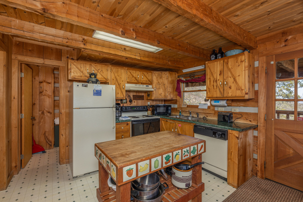 Kitchen with white appliances at Stellar View, a 1 bedroom cabin rental located in Pigeon Forge