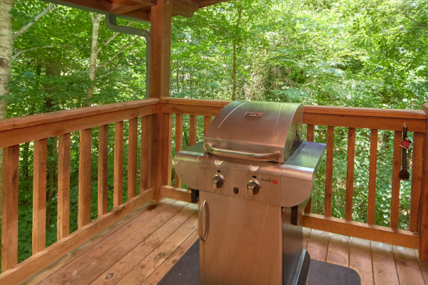 Grill on the covered deck at Wild Crush, a 1 bedroom cabin rental located in Pigeon Forge
