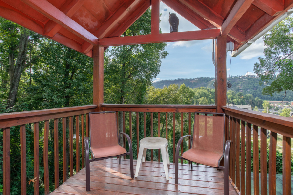 Deck with two chairs and a mountain view at Shiloh, a 3 bedroom cabin rental located in Gatlinburg
