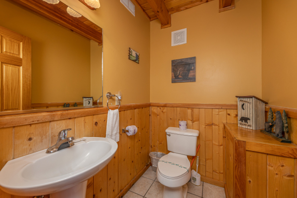 Half bath at Almost Bearadise, a 4 bedroom cabin rental located in Pigeon Forge