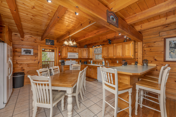 Dining space and kitchen at Almost Bearadise, a 4 bedroom cabin rental located in Pigeon Forge