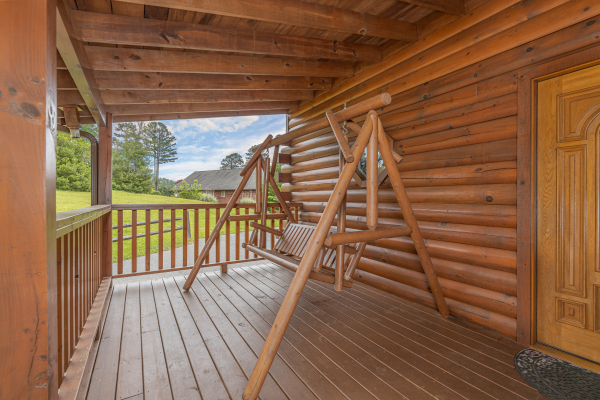 Porch swing at Almost Bearadise, a 4 bedroom cabin rental located in Pigeon Forge