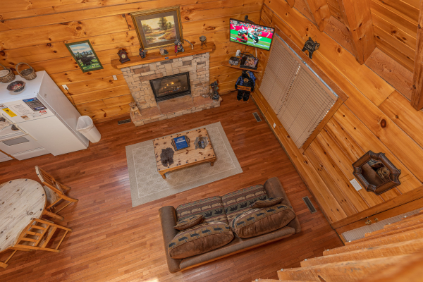 Looking down at the living room at Smoky Bears Creek, a 2 bedroom cabin rental located in Pigeon Forge