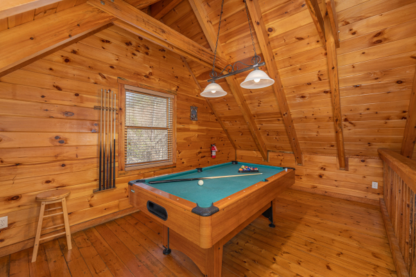 Pool table in the loft at Smoky Bears Creek, a 2 bedroom cabin rental located in Pigeon Forge