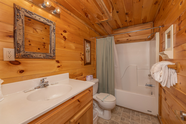 Bathroom with tub and shower at Smoky Bears Creek, a 2 bedroom cabin rental located in Pigeon Forge