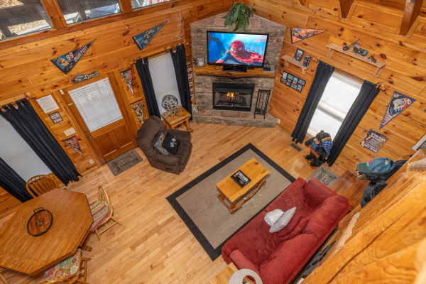Living room from the second floor at Nascar Nation, a 2 bedroom cabin rental located in Pigeon Forge