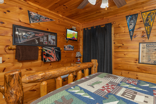 TV in a bedroom at Nascar Nation, a 2 bedroom cabin rental located in Pigeon Forge