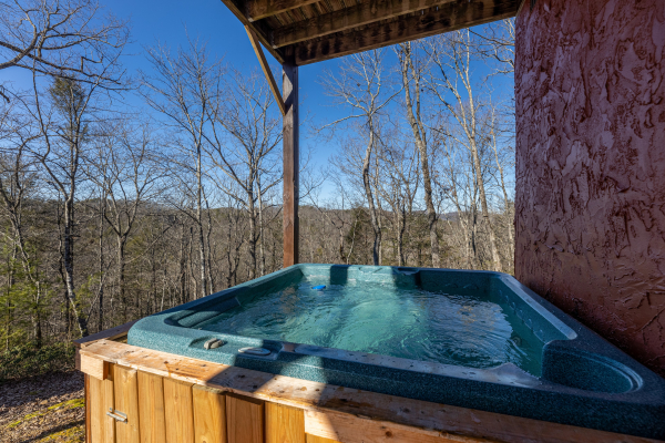 Hot tub on the lower deck at Nascar Nation, a 2 bedroom cabin rental located in Pigeon Forge