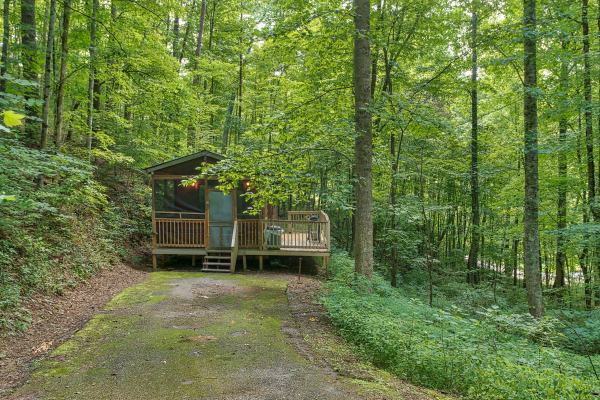 exterior view of the cabin and flat parking at angel's dream a 1 bedroom cabin rental located in gatlinburg