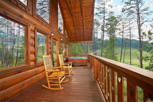 rocking chairs on the deck at always & forever a 1 bedroom cabin rental located in pigeon forge