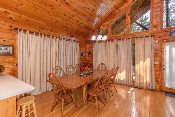 Dining room with seating for eight at Bear Country, a 3-bedroom cabin rental located in Pigeon Forge