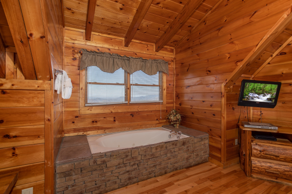 Jacuzzi tub in the loft bedroom at 5 Star View, a 3 bedroom cabin rental located in Gatlinburg