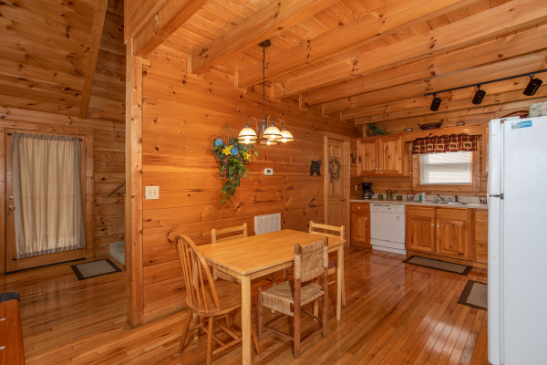Dining space and kitchen at Bearly Mine, a 1 bedroom Pigeon Forge cabin rental