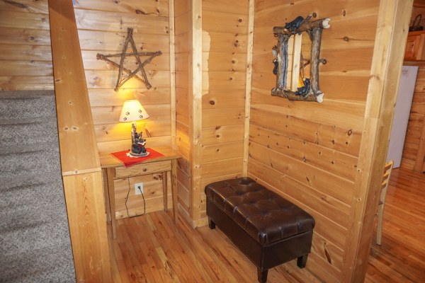 Bench in the foyer at Bearly Mine, a 1-bedroom cabin rental located in Pigeon Forge