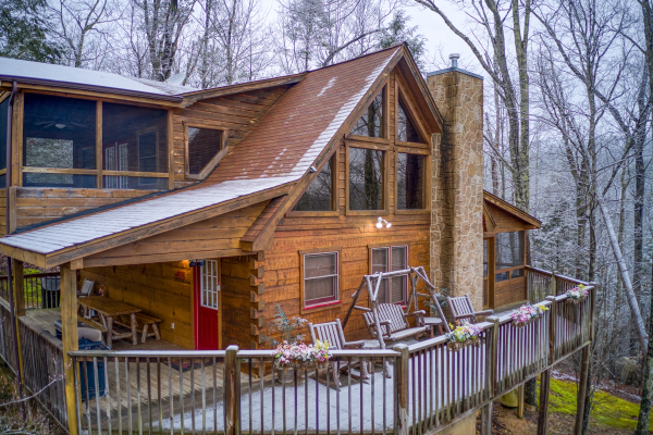 Alpine Romance, a 2 bedroom cabin rental located in Pigeon Forge with a dusting of snow