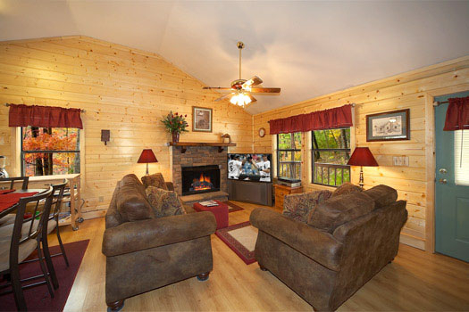 Living room with fireplace at Raccoon's Rest, a 2 bedroom cabin rental located in Pigeon Forge