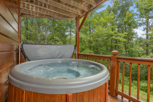 Hot tub on a deck at Wildlife Retreat, a 3 bedroom cabin rental located in Pigeon Forge