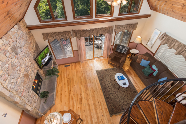 Looking down at the living room at Ain't Misbehaven, a 1 bedroom cabin rental located in Pigeon Forge