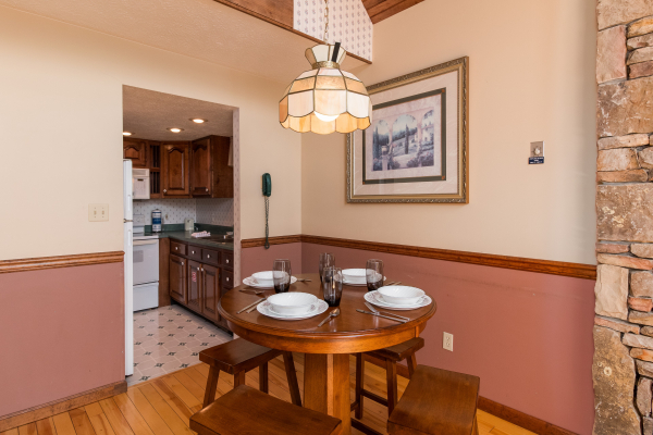 Dining table for four at Ain't Misbehaven, a 1 bedroom cabin rental located in Pigeon Forge