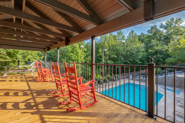 Pool deck for guests at Ain't Misbehaven, a 1 bedroom cabin rental located in Pigeon Forge
