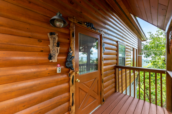 Front door with custom woodwork at Away From it All, a 1 bedroom cabin rental located in Pigeon Forge